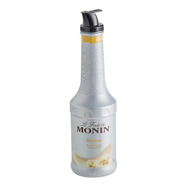 A silver Monin bottle of Banana Fruit Puree with a black lid.