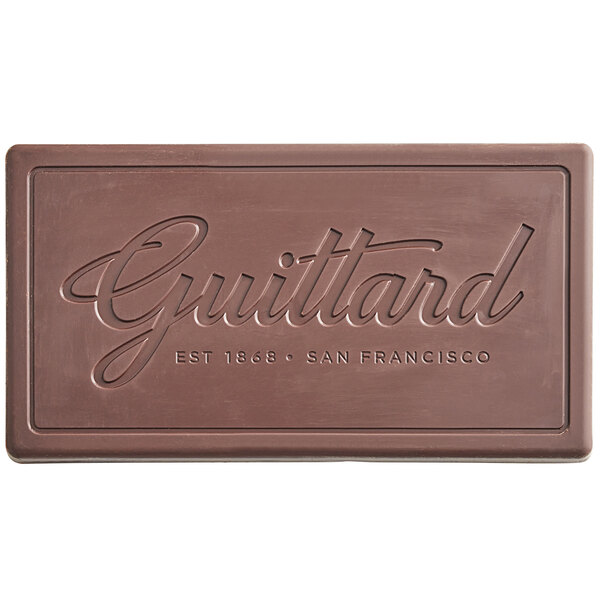 A brown rectangular Guittard French Vanilla chocolate bar with writing on it.