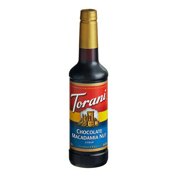 A close up of a Torani Chocolate Macadamia Nut Flavoring Syrup bottle with a gold cap.