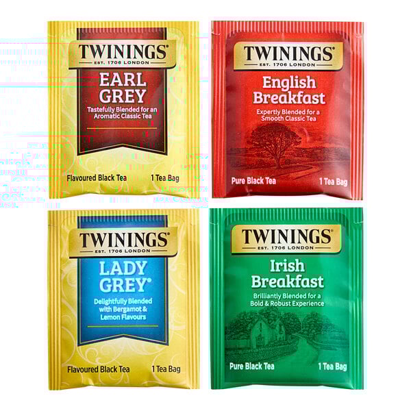 A case of Twinings black tea variety tea bags with yellow, blue, green, and red packaging.