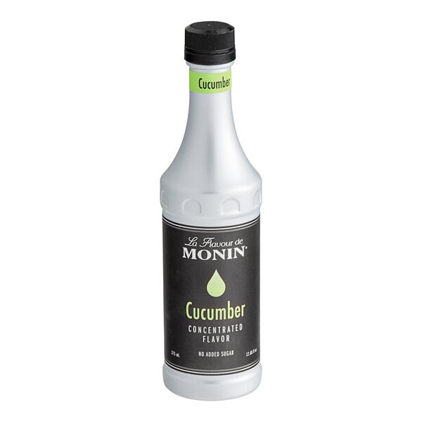 A white Monin bottle of cucumber concentrate with a black label.