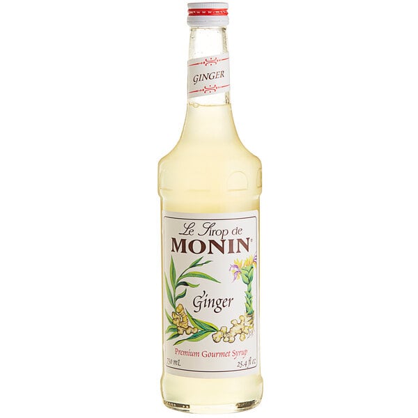 A bottle of Monin Premium Ginger Flavoring Syrup with a label.