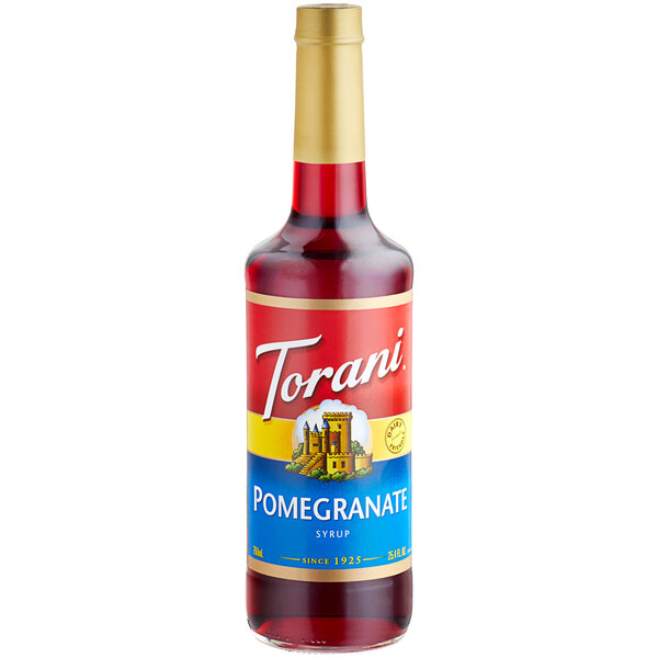 A Torani Pomegranate Fruit Syrup bottle with a label.