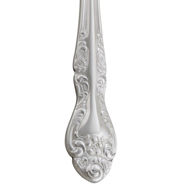 A Oneida Rosewood stainless steel bouillon spoon with a silver handle.