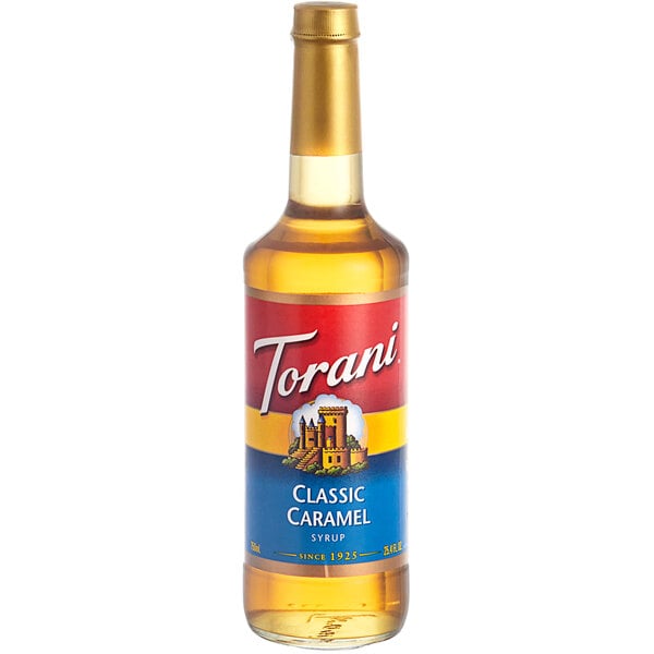 A Torani Classic Caramel flavoring syrup 750 mL glass bottle with a label.