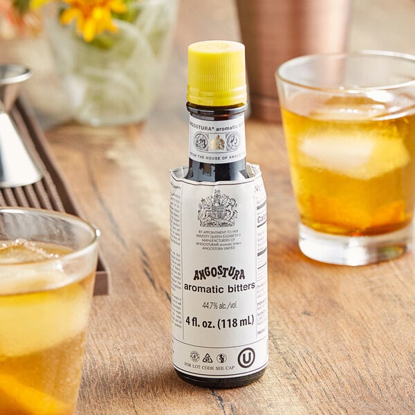 A 4 fl. oz. bottle of Angostura aromatic bitters with a yellow cap.
