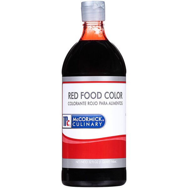 A close up of a McCormick Culinary Red Food Color bottle with red liquid inside.