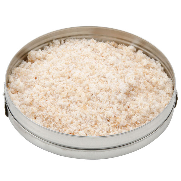 A round metal container of white powder.