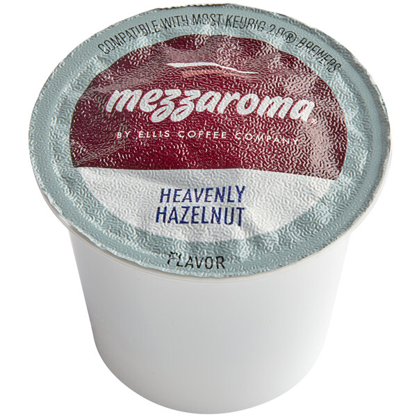 A white Ellis single serve coffee cup with a red and blue label.