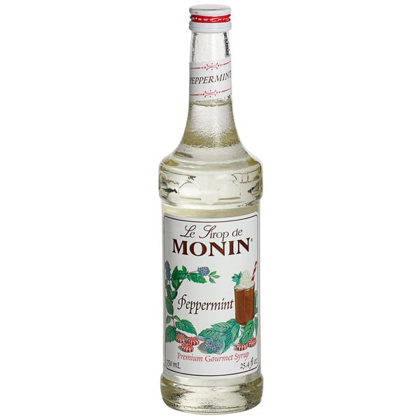 A Monin peppermint syrup bottle on a white background.