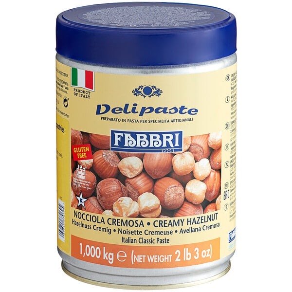 A can of Fabbri hazelnut flavoring paste with a blue lid.