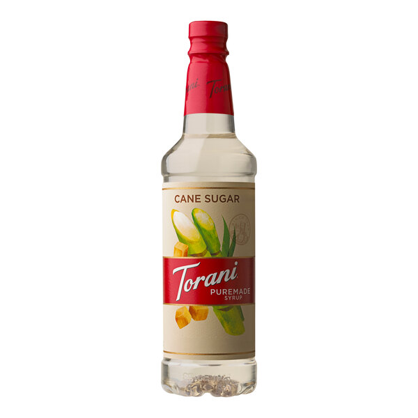 A close up of a Torani Puremade Pure Cane Sugar Flavoring Syrup bottle with a label.