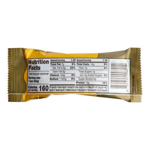 A chocolate hazelnut vitamin and protein bar in a gold and yellow wrapper with nutrition facts displayed on the back.