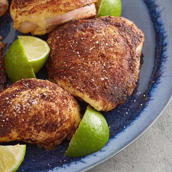 A plate of food with a lime cut in half and Regal Chipotle Powder on top.
