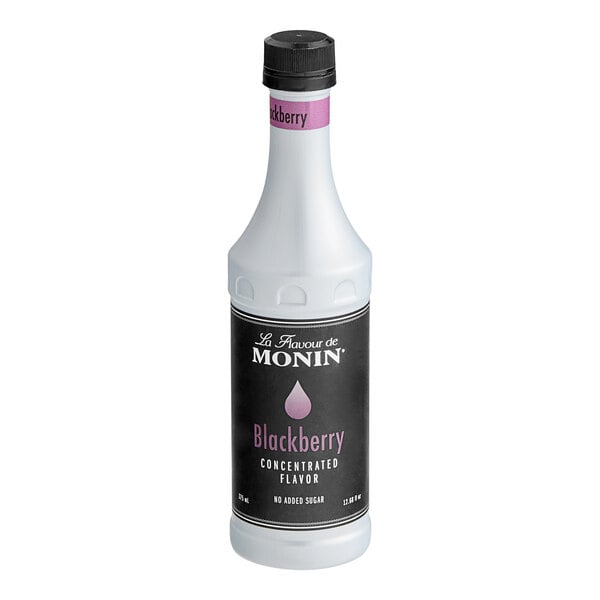 A white Monin bottle of blackberry concentrated flavor with a black label.