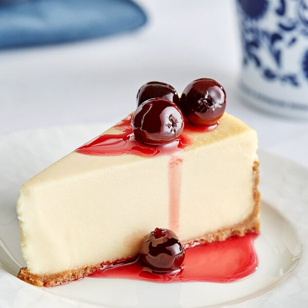 A slice of cheesecake topped with Fabbri Amarena cherries.