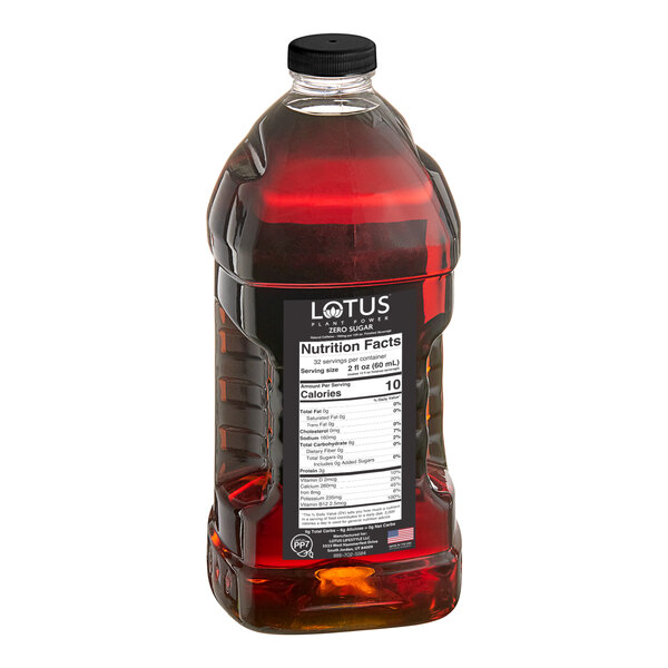 A bottle of Lotus Plant Power Sugar-Free Gold Lotus Energy Concentrate with a white label.