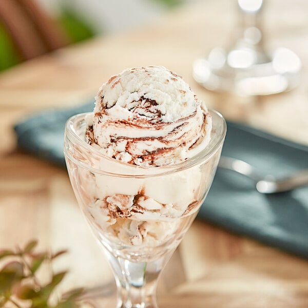 A glass with a scoop of Oringer dark chocolate variegate ice cream.