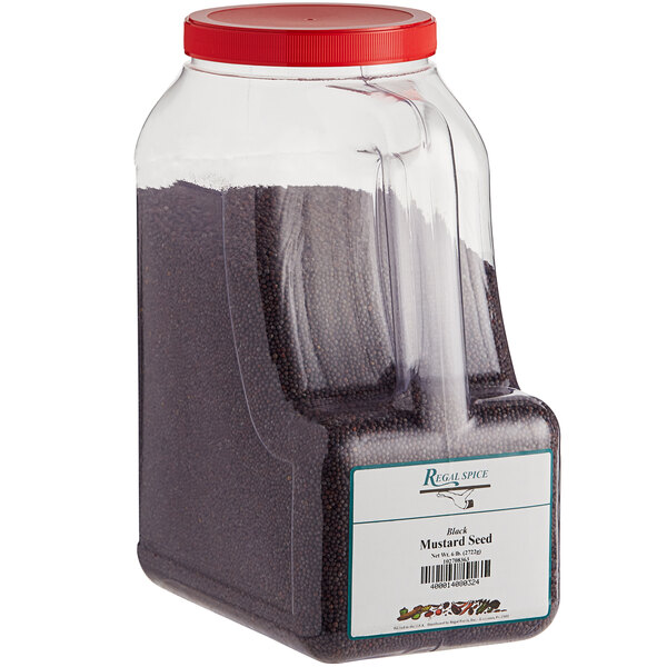 A plastic container of Regal black mustard seed with a red lid.