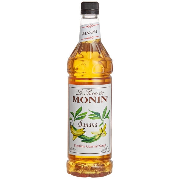 A 1 liter bottle of Monin Banana Syrup with a label.
