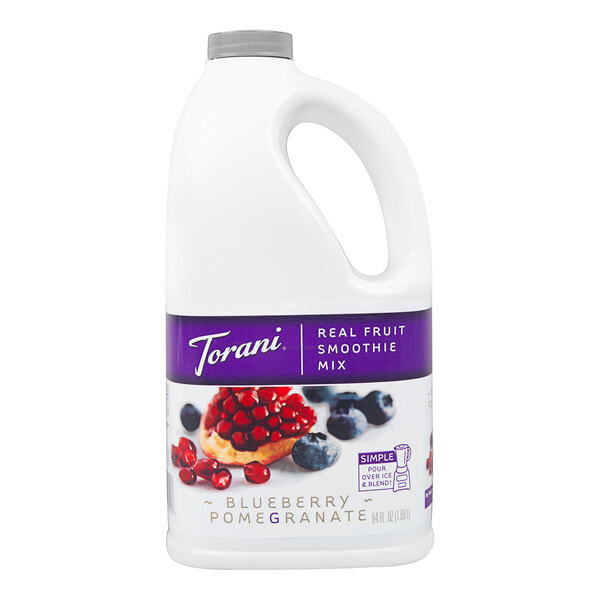 A white plastic jug of Torani Blueberry Pomegranate Fruit Smoothie Mix with a purple label.