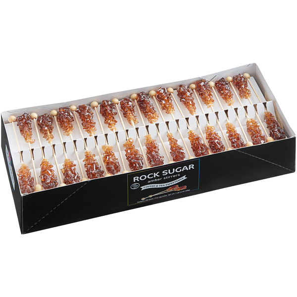 A box of 12 Roses Dryden and Palmer amber rock candy barista stirrers.