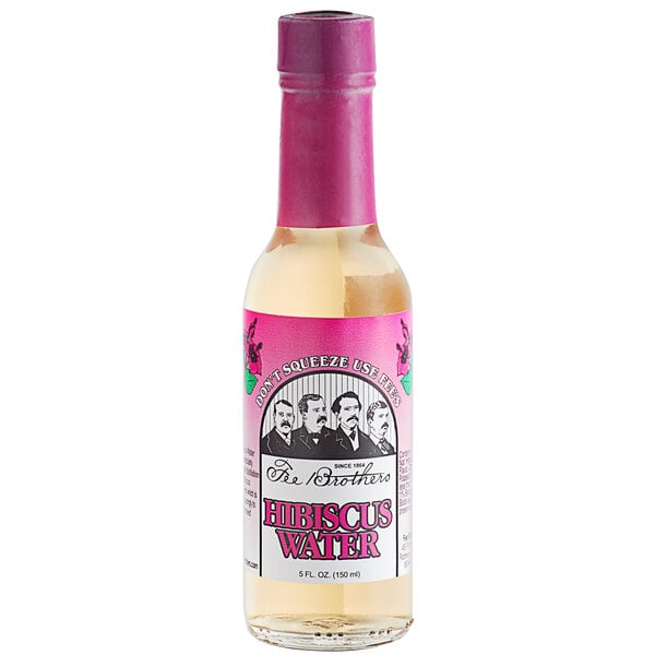 A bottle of Fee Brothers Hibiscus Water with a pink label.