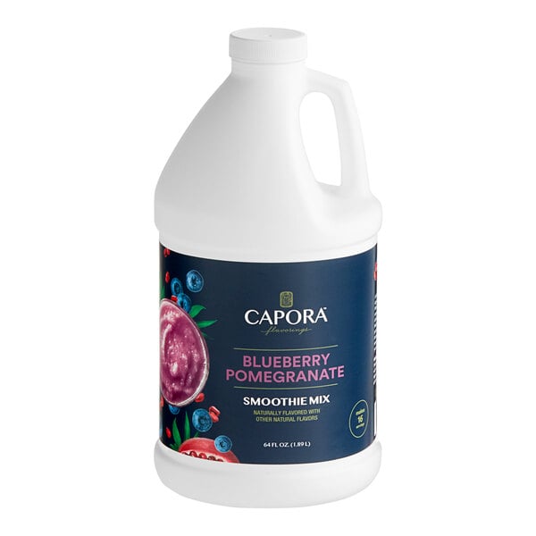 A white Capora jug with a blue label reading "Blueberry Pomegranate" and "Fruit Smoothie Mix" containing blue liquid.