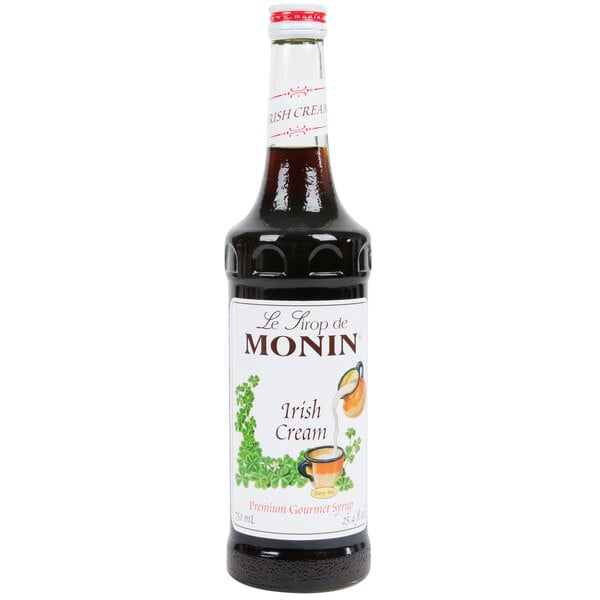 A bottle of Monin Irish Cream flavoring syrup with a white label.