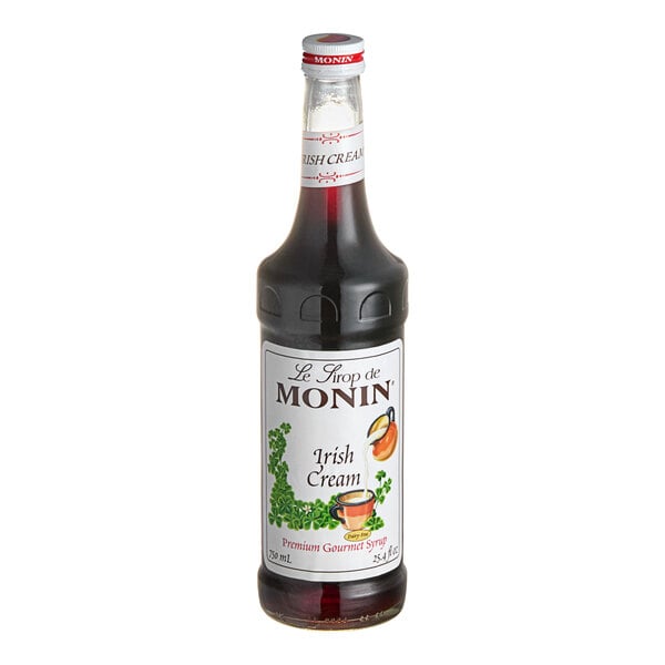 A Monin Irish Cream syrup bottle with a label.