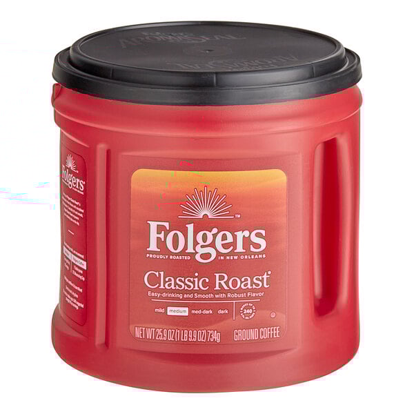 A red Folgers Classic Roast coffee can with a black lid.