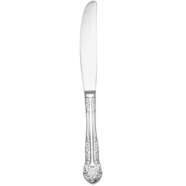 A Oneida stainless steel dinner knife with a rosewood handle.