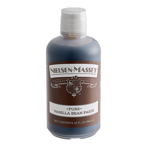 A close-up of a Nielsen-Massey Pure Vanilla Paste bottle with a white cap and label.