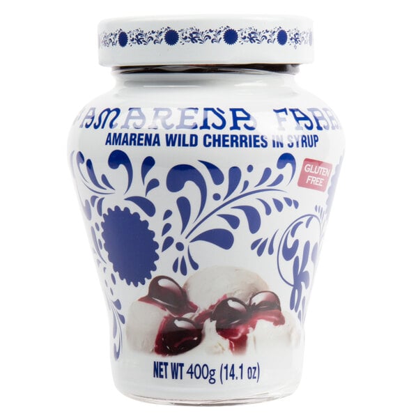 A jar of Fabbri Amarena Cherries in syrup with a white lid and a picture of cherries.