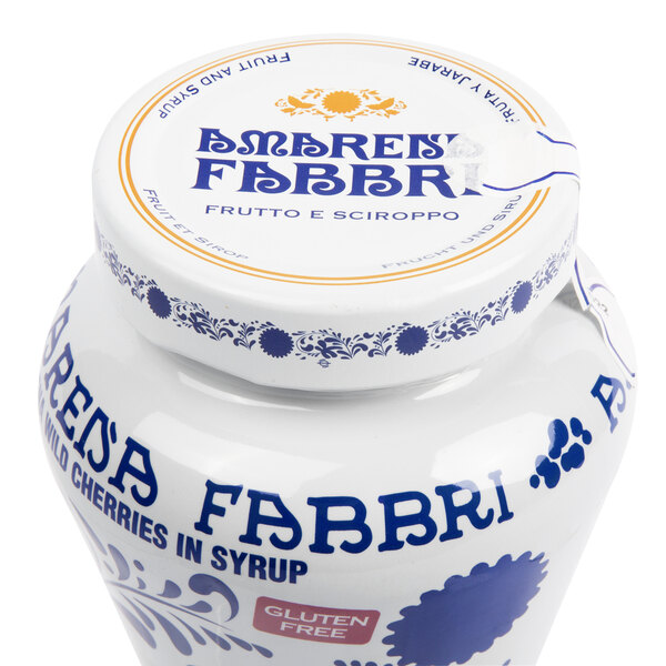 A white jar of Fabbri Amarena Cherries with blue and white text.