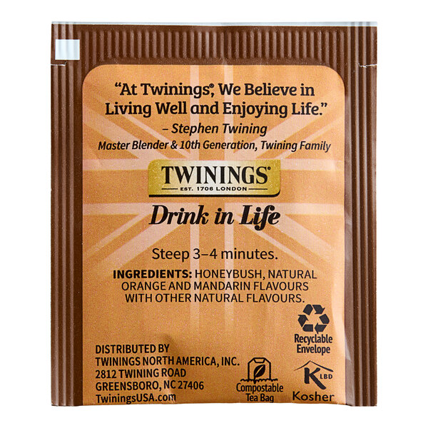 A package of Twinings Honeybush, Mandarin & Orange Herbal Tea Bags on a table.