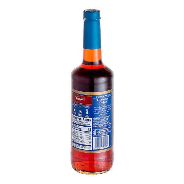 A Torani Sugar-Free Cinnamon Vanilla flavoring syrup bottle with a blue label.