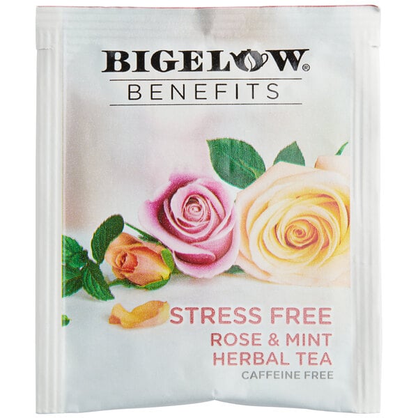 A white Bigelow package of rose and mint herbal tea bags with flowers on it.