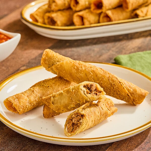 A plate of Posada Birria Beef Crunchero Rolled Tacos.