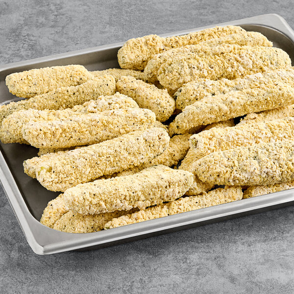 Breaded Fred's Pickle Spears on a table.