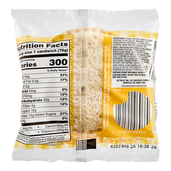 A package of Smucker's Uncrustables Whole Wheat Sandwiches with a label.