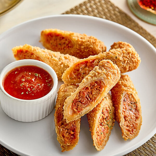 A plate of Crunch Factory Pepperoni Pizza Crunch Rolls with red sauce.