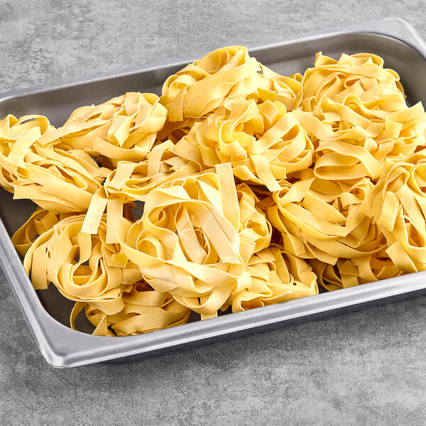 A tray of Seviroli Vertullo Tagliatelle Pasta on a gray surface.