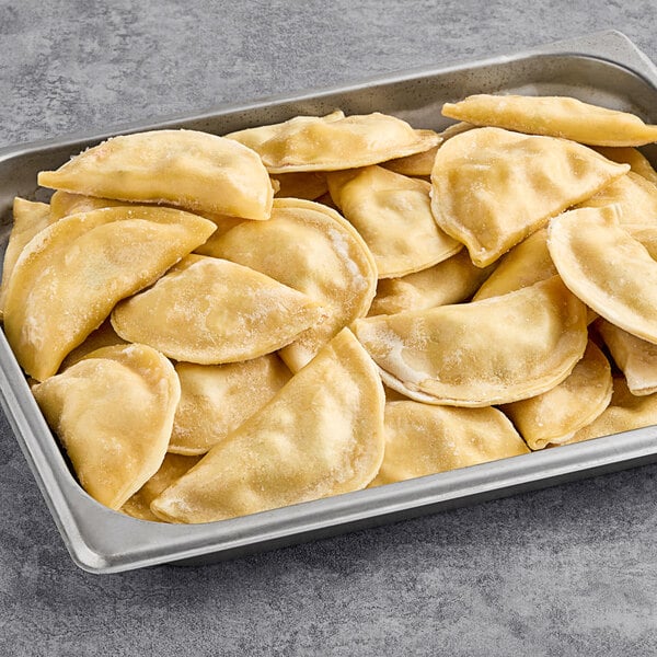 A pan filled with Maple Leaf Farms Duck and Sweet Corn Wontons.