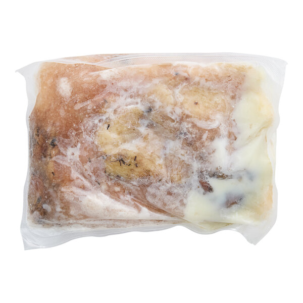 A plastic bag of Maple Leaf Farms fully cooked duck leg confit with white and blue packaging.
