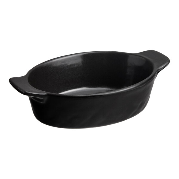 A small black oval porcelain dish with handles on each end.