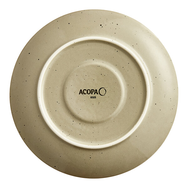 A granite gray porcelain saucer with a white center and black text on the rim.