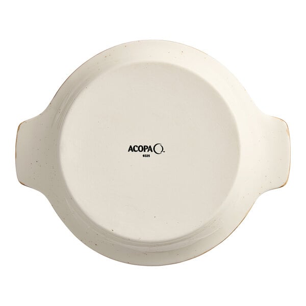 An Acopa Keystone porcelain shirred egg casserole dish with handles and a lid.