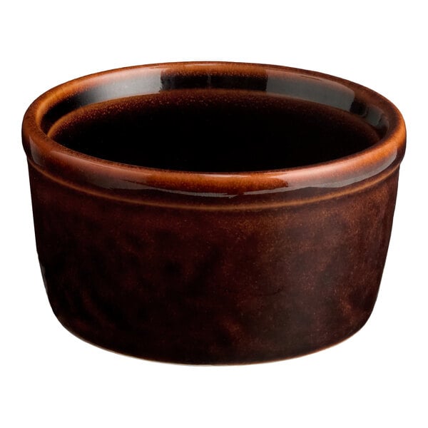 A small, round, brown porcelain ramekin.