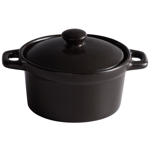 An Acopa Keystone black porcelain mini casserole dish with a lid.